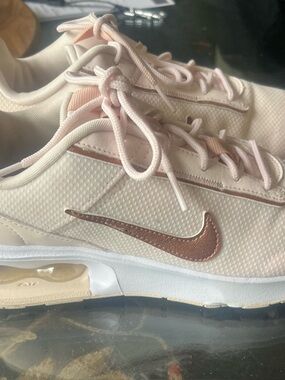 Nike Women's Blush Pink Sneakers with Rose Gold Swoosh